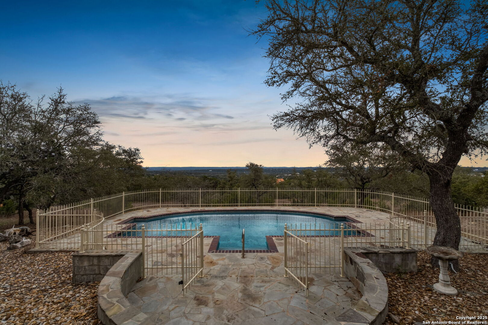 1069 Fawn River Drive Spring Branch, TX 78070 - Photo 1 of 25 a view of a swimming pool with a patio and a yard