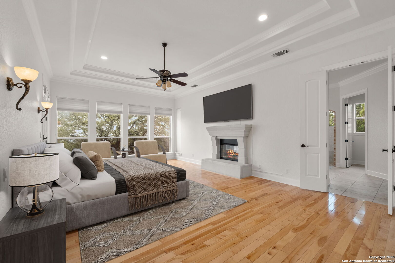 1069 Fawn River Drive Spring Branch, TX 78070 - Photo 12 of 25 a spacious bedroom with a bed and a flat screen tv