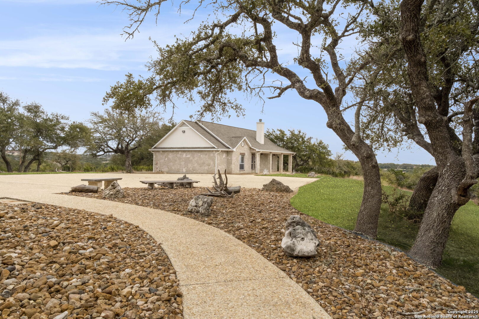 1069 Fawn River Drive Spring Branch, TX 78070 - Photo 17 of 25 a view of a house with a yard and large tree