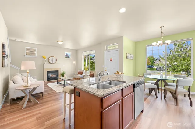 a kitchen island with granite countertop dining room and granite countertop a sink