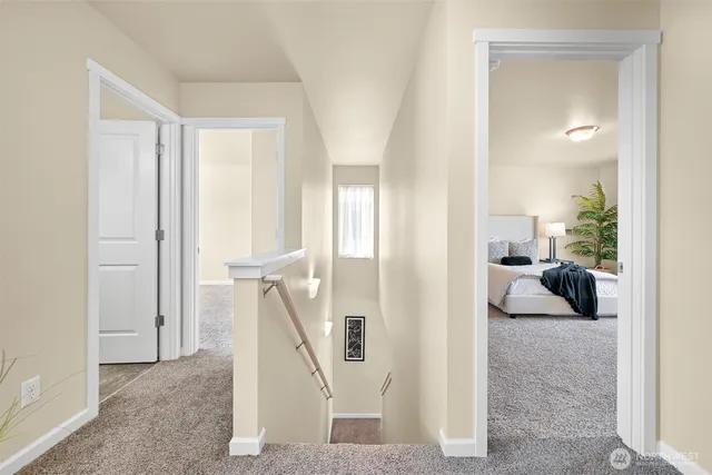 a view of a livingroom with a couch and stairs