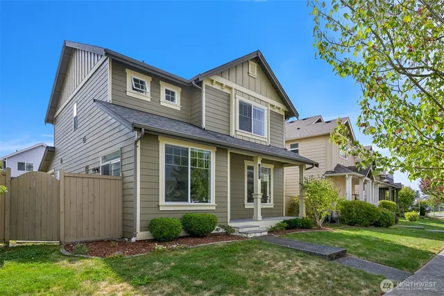 a view of a house with a yard and plants