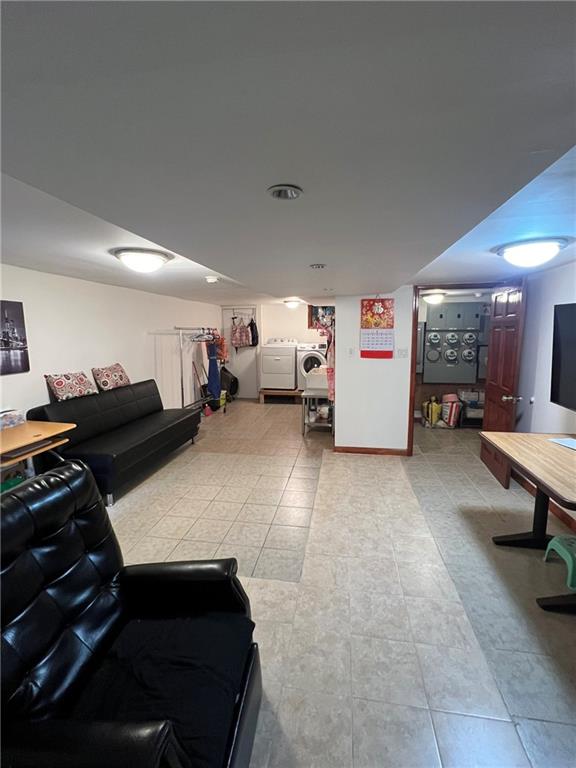 6710 13th Avenue Brooklyn, NY 11219 - Photo 8 of 9 a living room with furniture and a piano