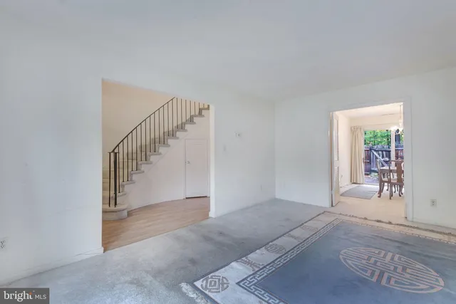 a view of entryway and hall with a couch