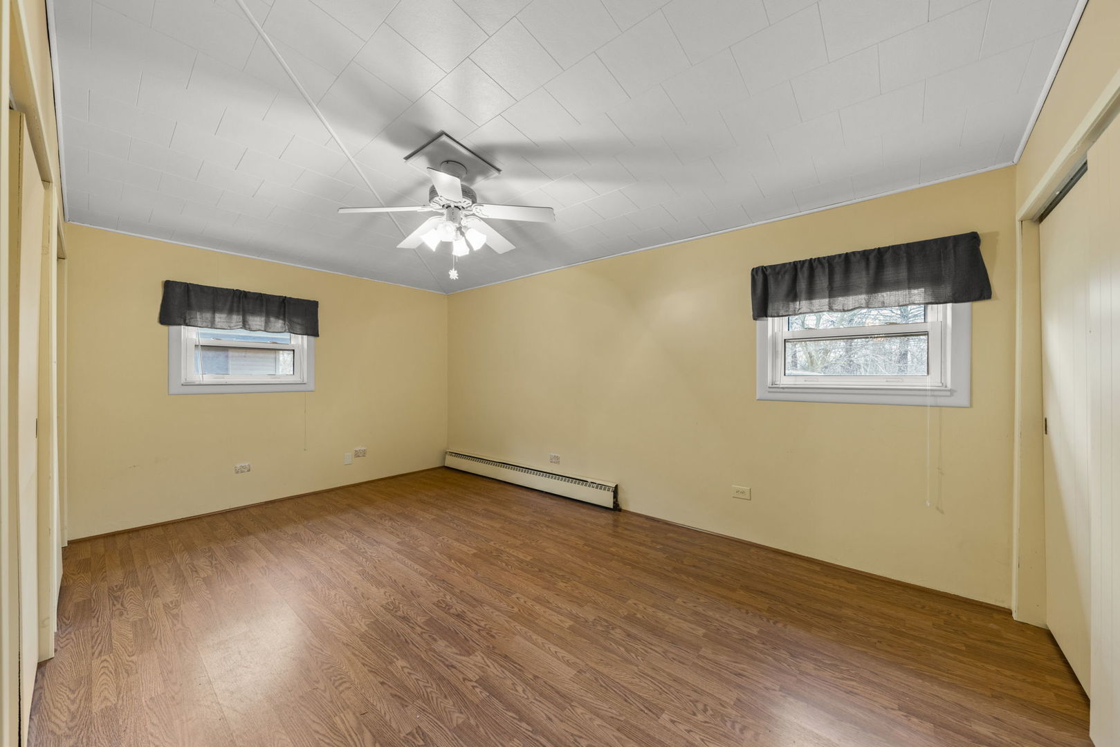 27257 South Scheer Road Manhattan, IL 60442 - Photo 17 of 41 a view of an empty room with wooden floor and a window