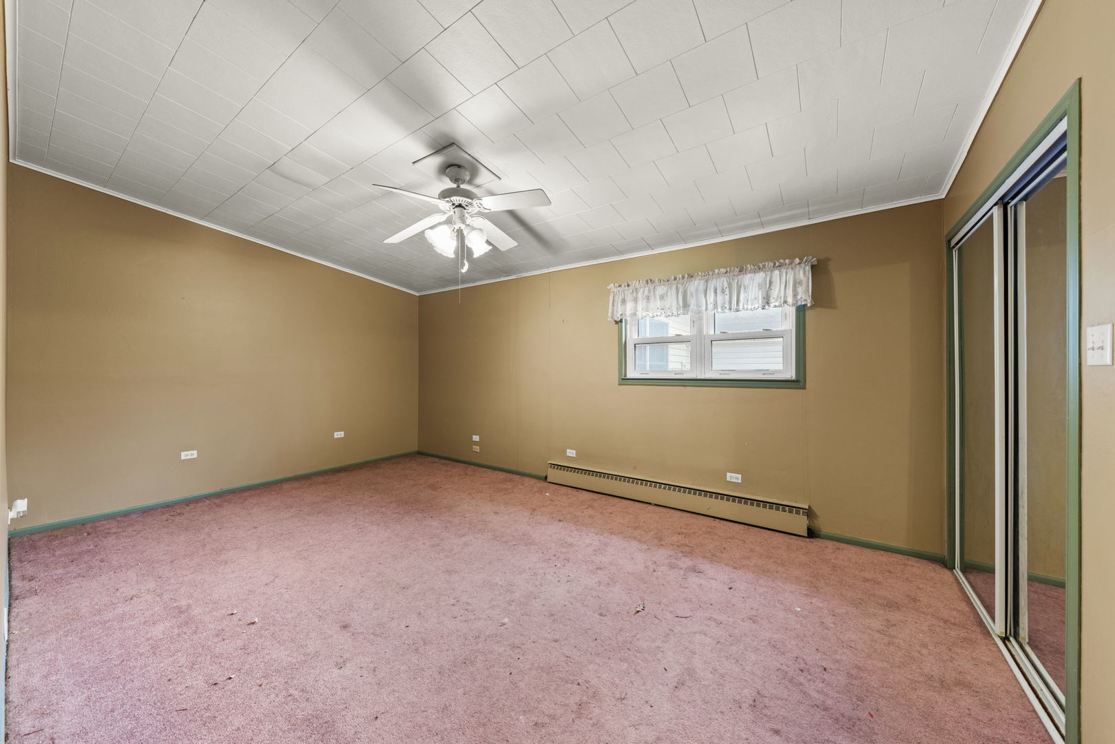 27257 South Scheer Road Manhattan, IL 60442 - Photo 18 of 41 an empty room with chandelier fan and windows