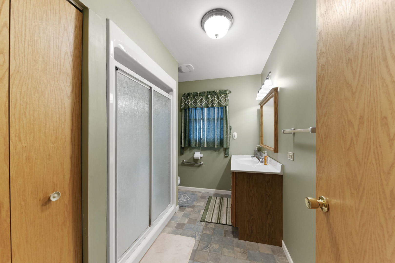 27257 South Scheer Road Manhattan, IL 60442 - Photo 23 of 41 a bathroom with a sink mirror and shower