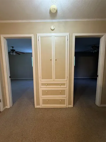 a view of backyard of house with green space