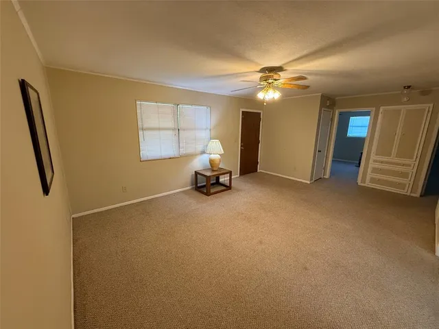 a bed room with a bed and mirror