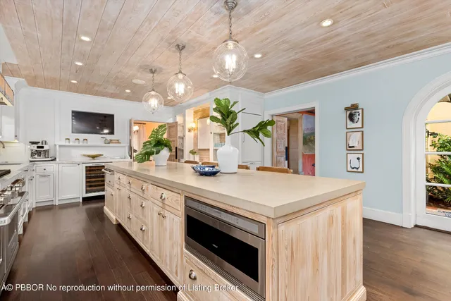 a kitchen with stainless steel appliances a stove sink microwave and cabinets
