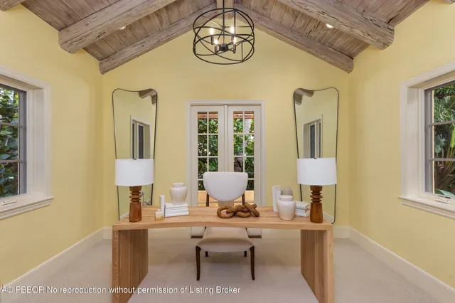 a living room with furniture a lamp and a window