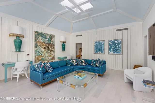 a lobby with furniture and a potted plant