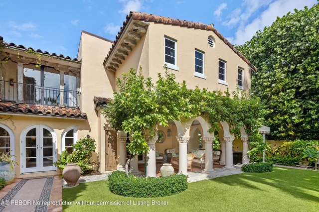 front view of a house with a garden