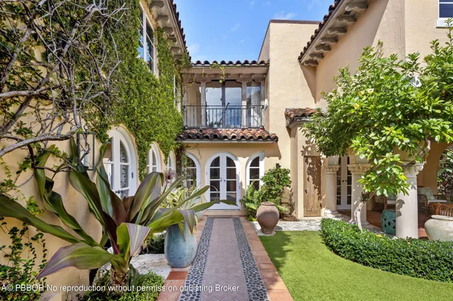a view of a brick building next to a yard