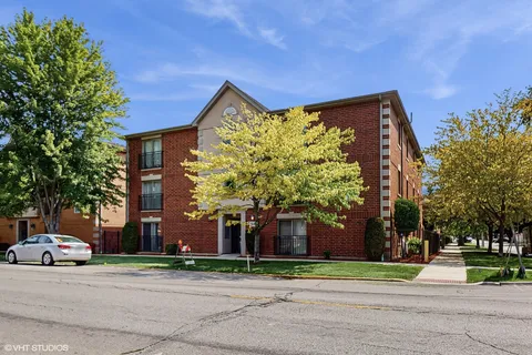 a view of a parked cars in front of a building