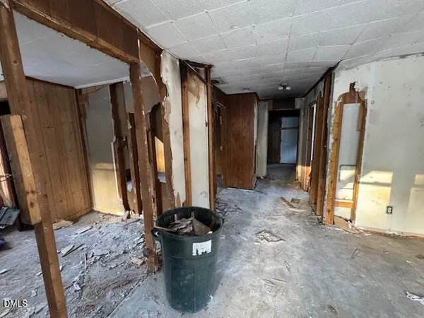 a view of hallway with furniture