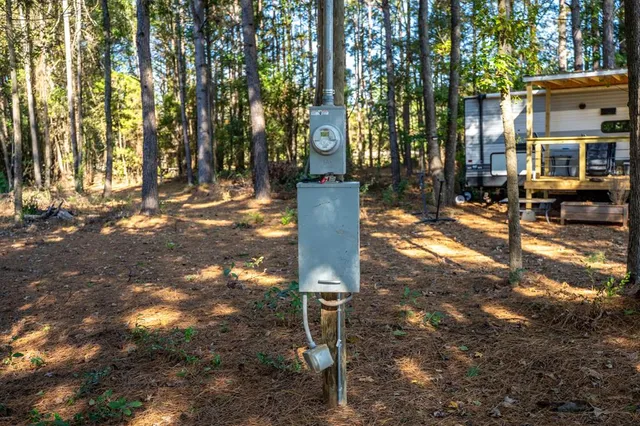 a sign board with yard in the back