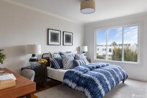 a bedroom with bed and window