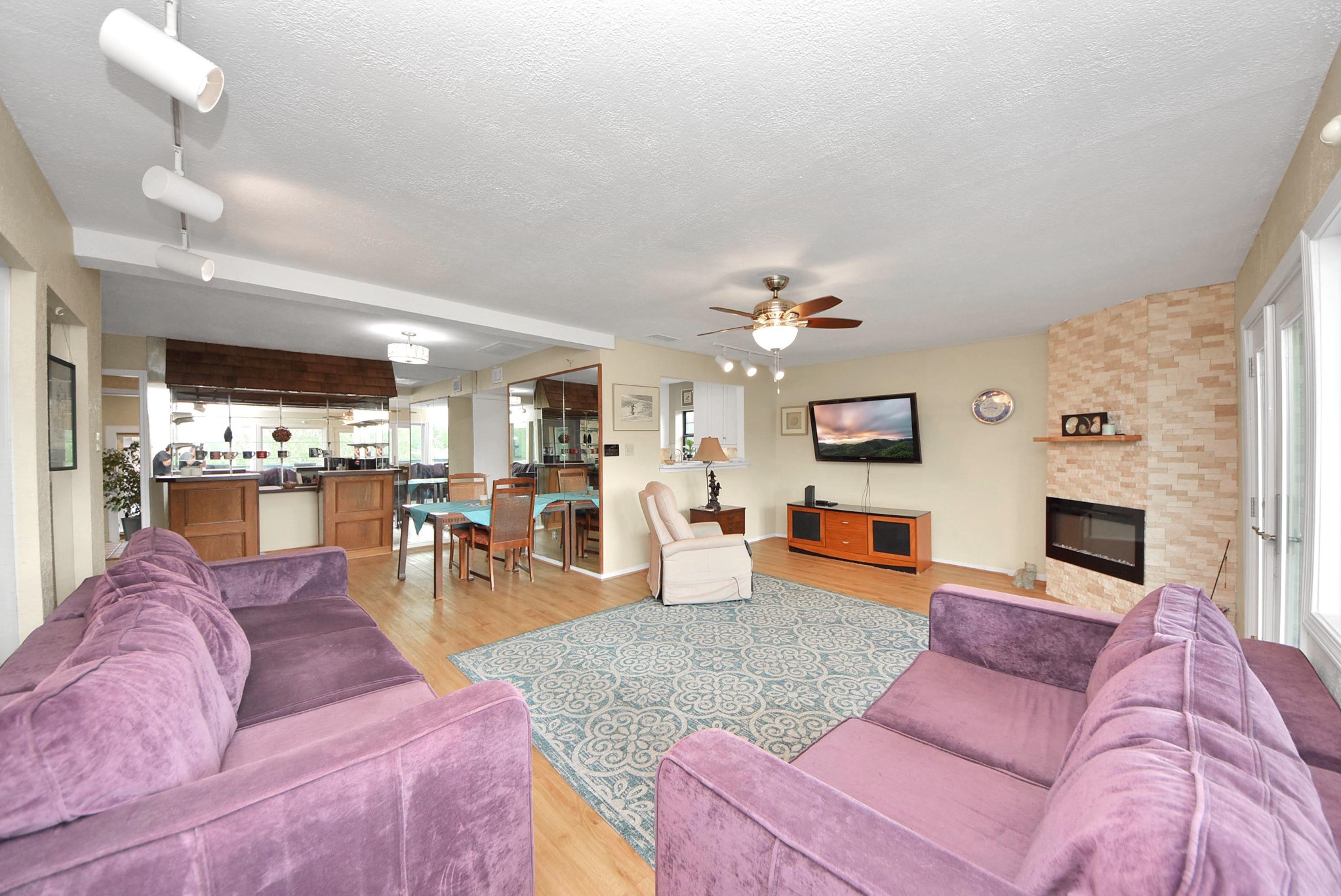 2117 Casa Rio Circle Dickinson, TX 77539 - Photo 13 of 23 a living room with furniture kitchen view and a flat screen tv