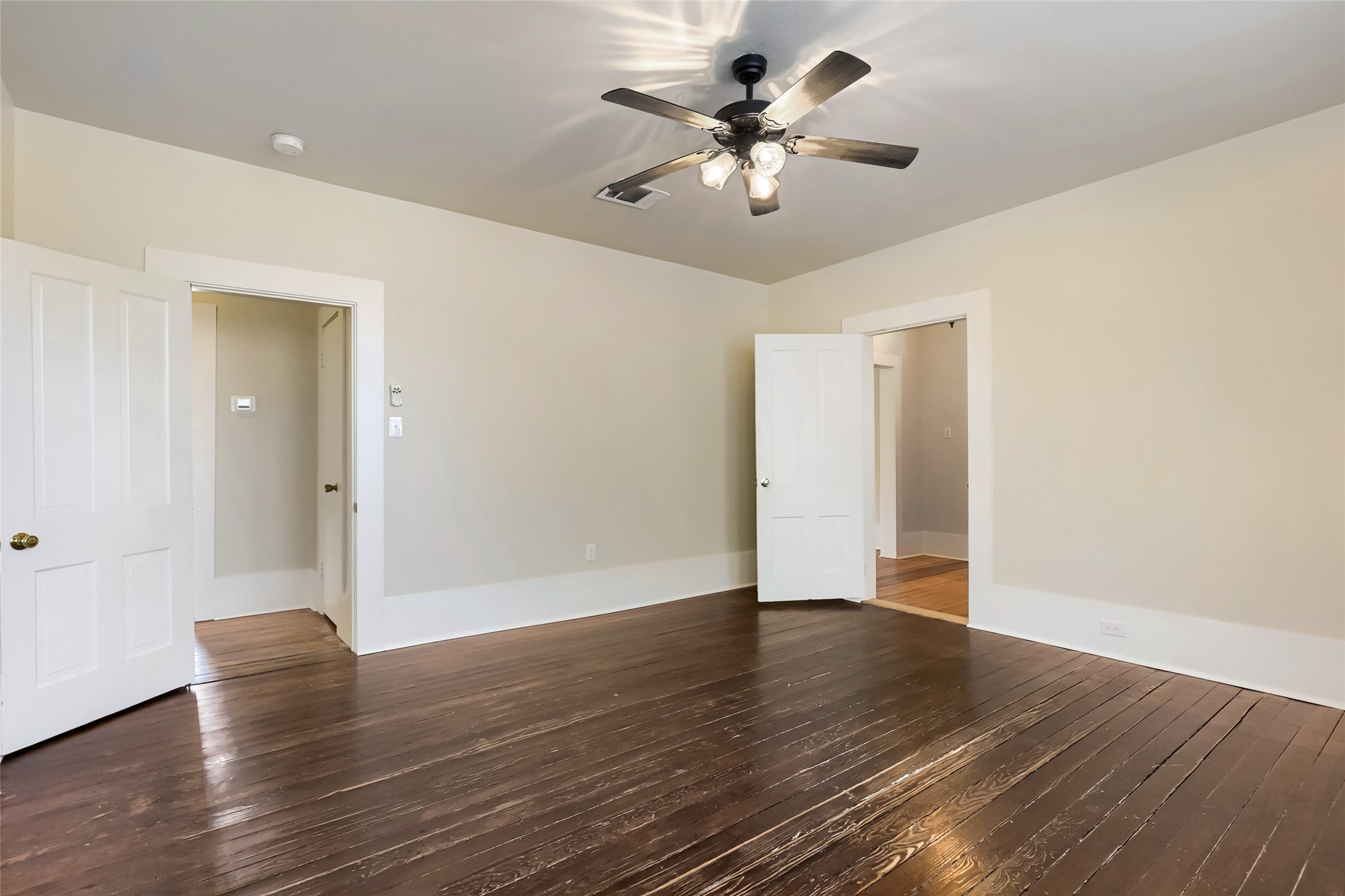208 North Ave B Elgin, TX 78621 - Photo 21 of 29 a view of an empty room with wooden floor