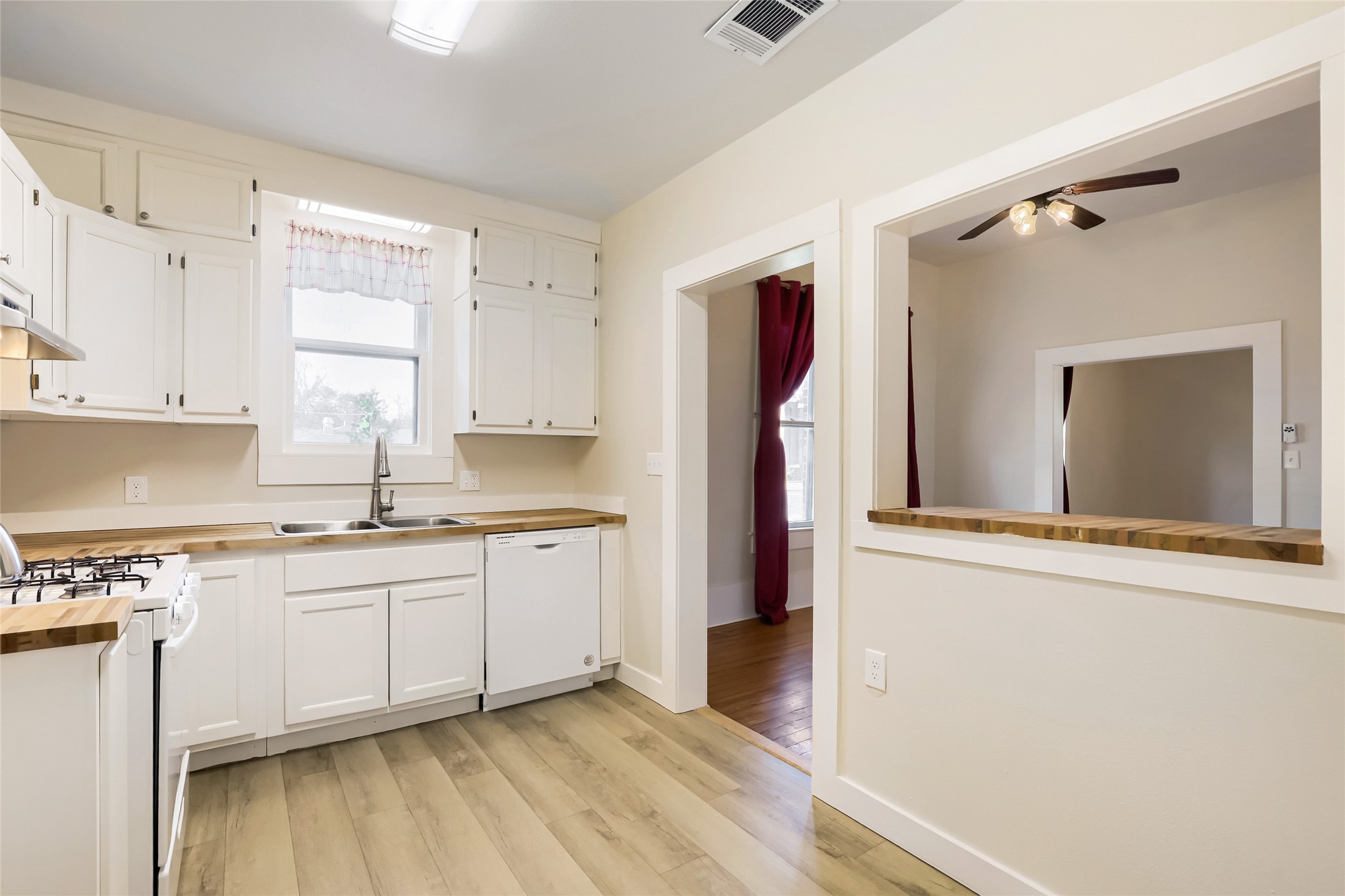 208 North Ave B Elgin, TX 78621 - Photo 9 of 29 a kitchen with stainless steel appliances granite countertop a refrigerator and a sink