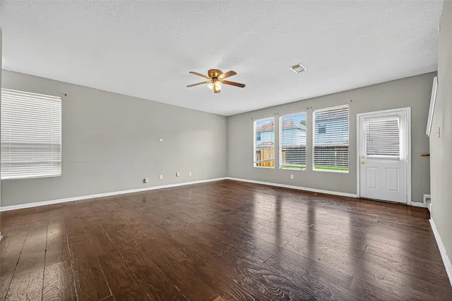 a kitchen with granite countertop a stove a sink and a microwave