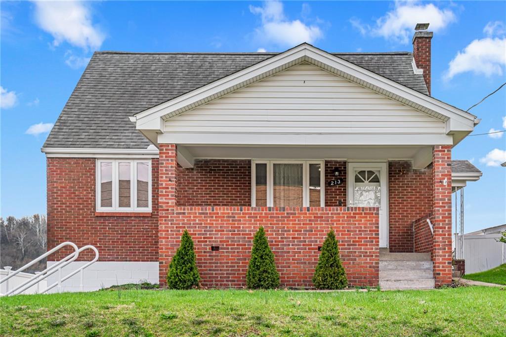 213 Scene Ridge Road McKeesport, PA 15133 - Photo 1 of 22 front view of a house with a yard