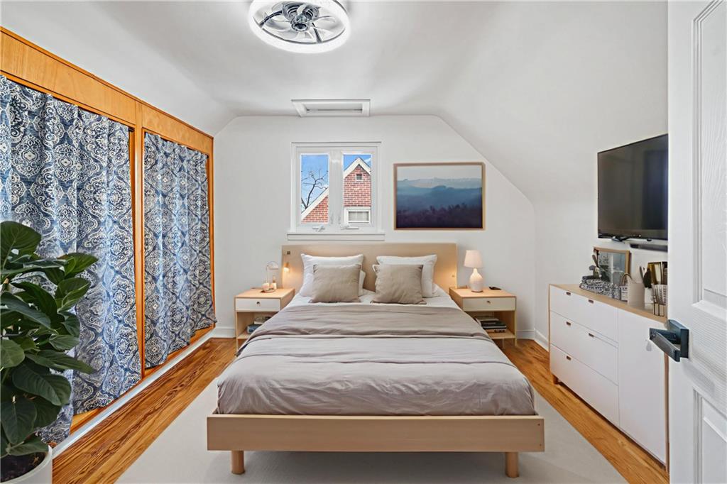 213 Scene Ridge Road McKeesport, PA 15133 - Photo 12 of 22 a bedroom with a bed and a flat screen tv