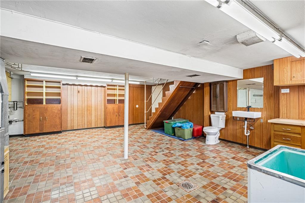 213 Scene Ridge Road McKeesport, PA 15133 - Photo 16 of 22 a view of an empty room with wooden floor and windows