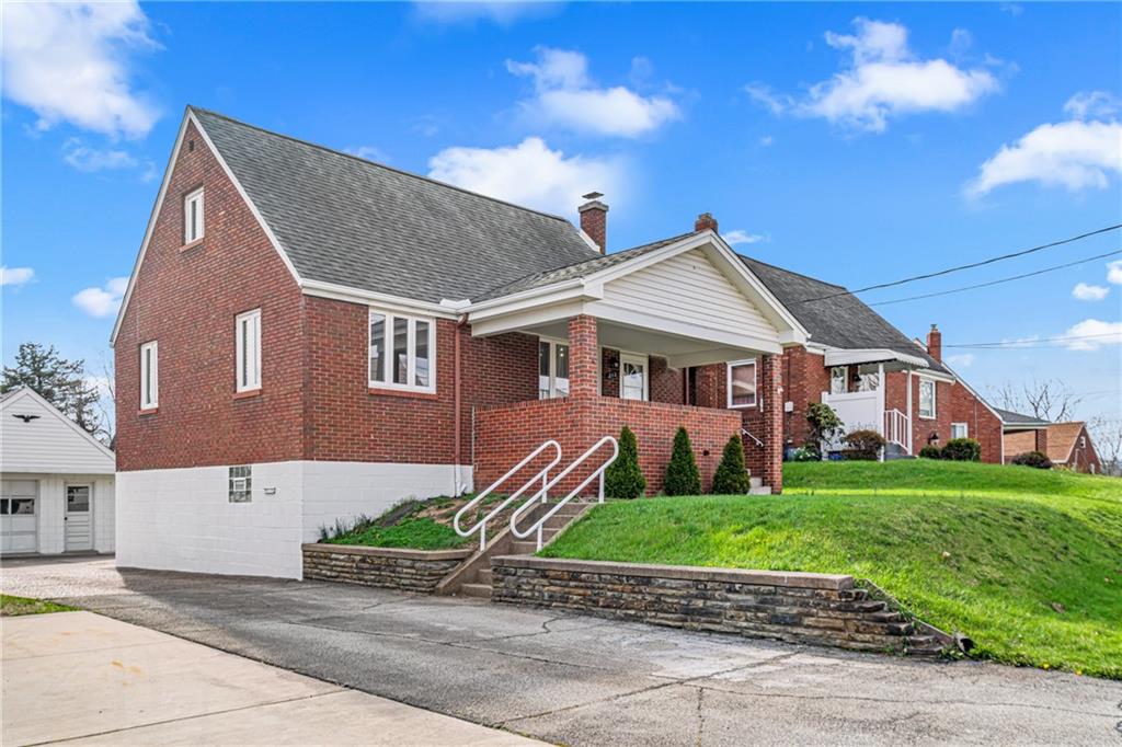 213 Scene Ridge Road McKeesport, PA 15133 - Photo 2 of 22 a view of a yard in front of a house