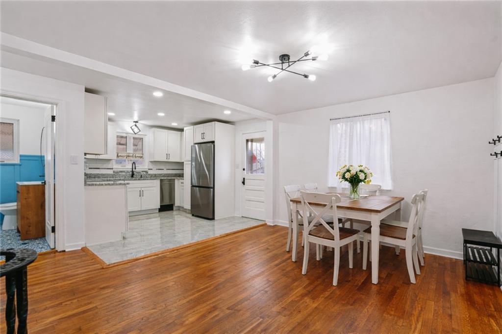 213 Scene Ridge Road McKeesport, PA 15133 - Photo 5 of 22 a view of a dining room with furniture and wooden floor