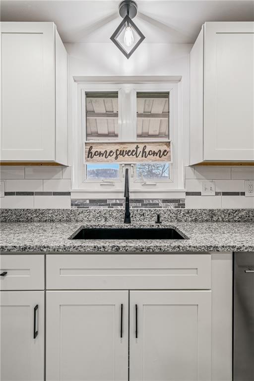 213 Scene Ridge Road McKeesport, PA 15133 - Photo 8 of 22 a kitchen with granite countertop a sink and a stove