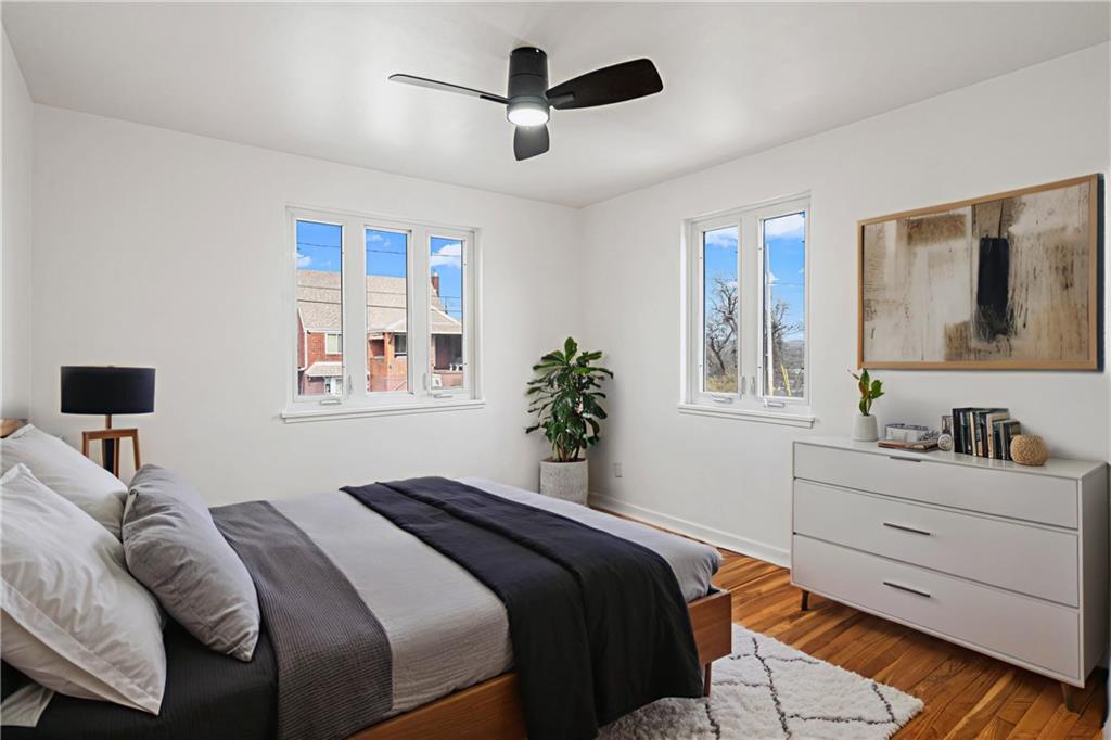 213 Scene Ridge Road McKeesport, PA 15133 - Photo 9 of 22 a bedroom with a large bed and a window