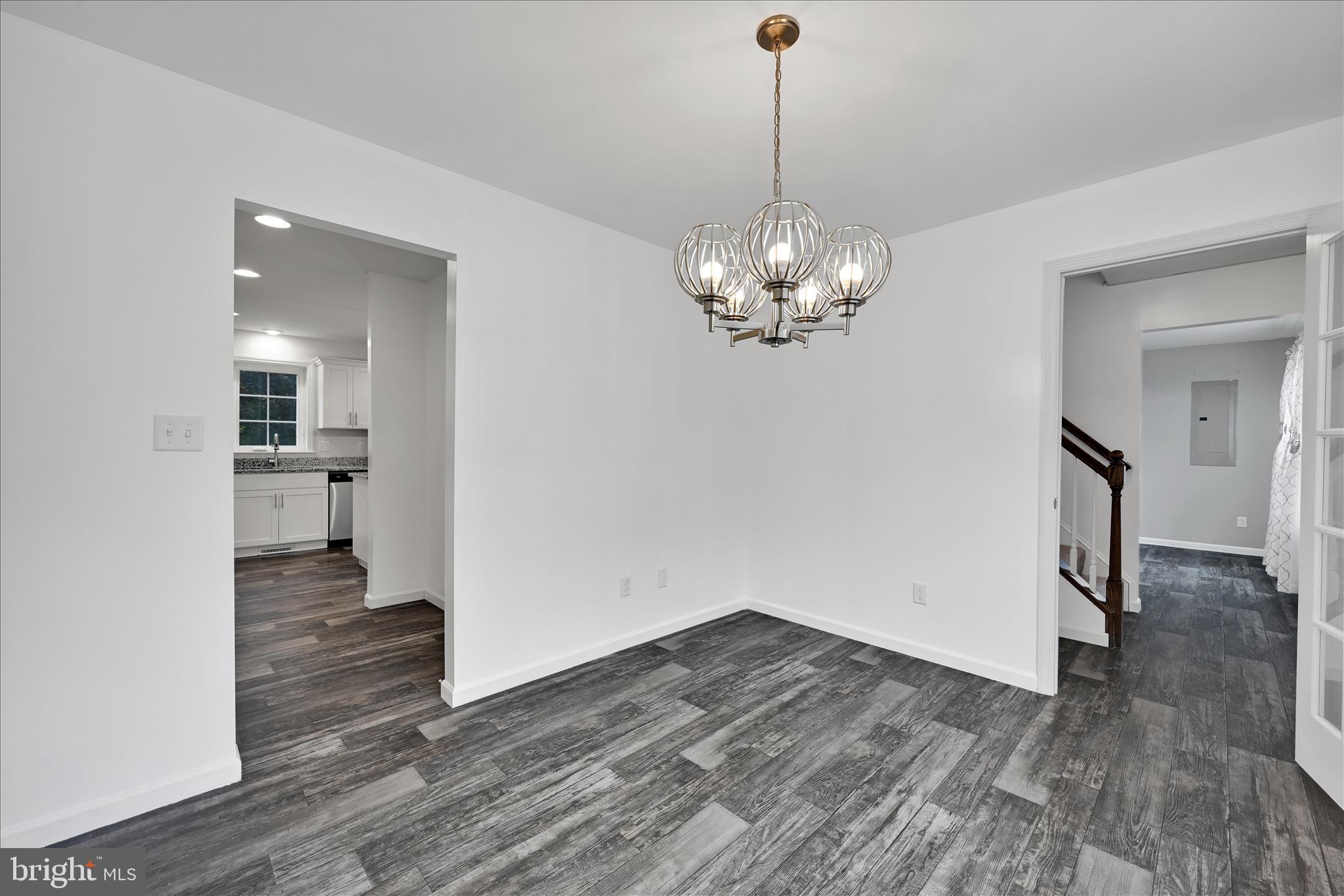 1485 Graystone Road Manheim, PA 17545 - Photo 11 of 43 a view of a hallway with wooden floor and a chandelier