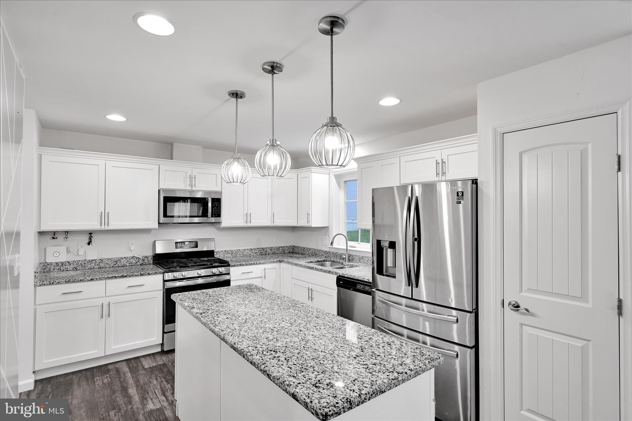 1485 Graystone Road Manheim, PA 17545 - Photo 13 of 43 a kitchen with stainless steel appliances granite countertop a sink refrigerator and microwave