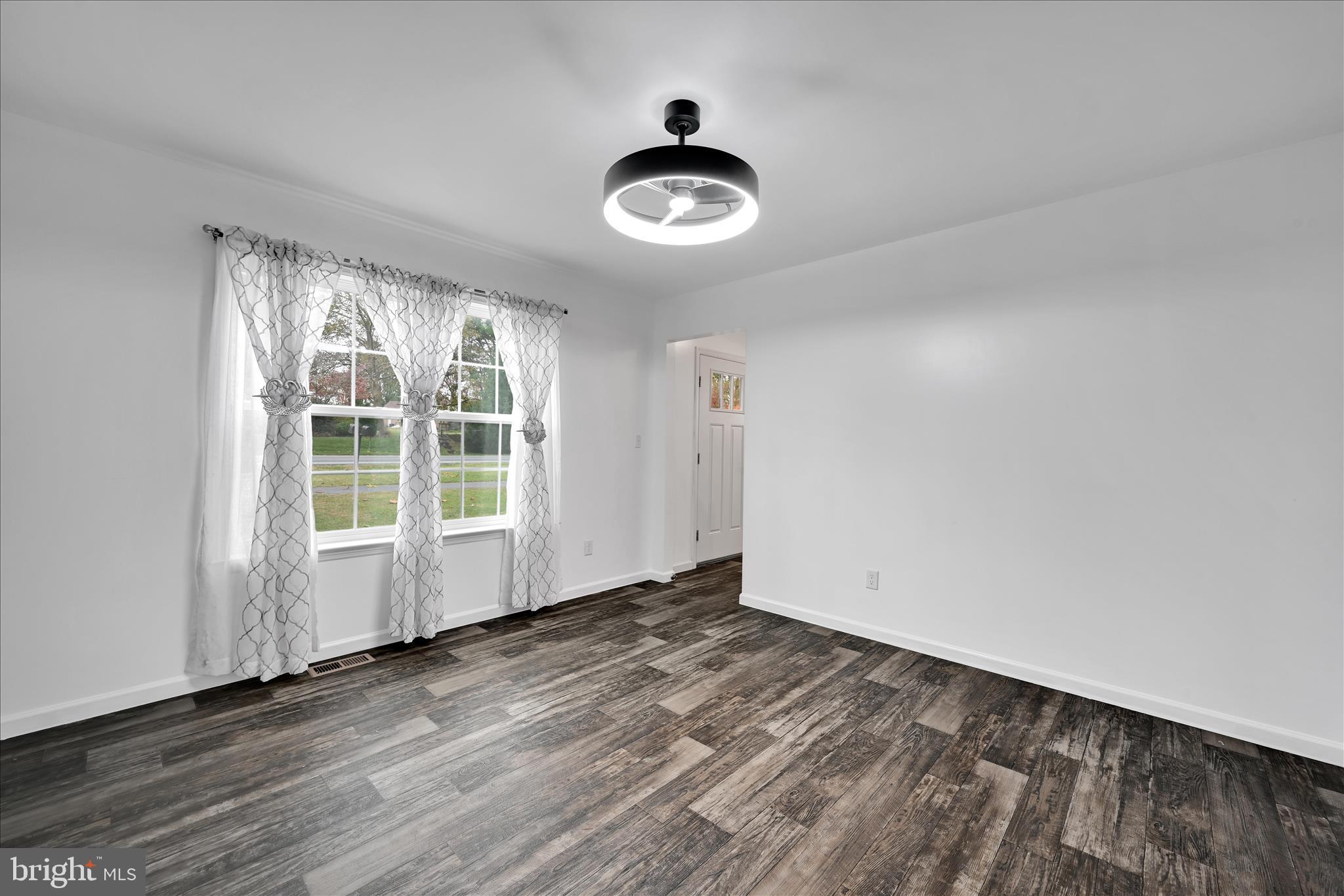 1485 Graystone Road Manheim, PA 17545 - Photo 18 of 43 an empty room with wooden floor and windows