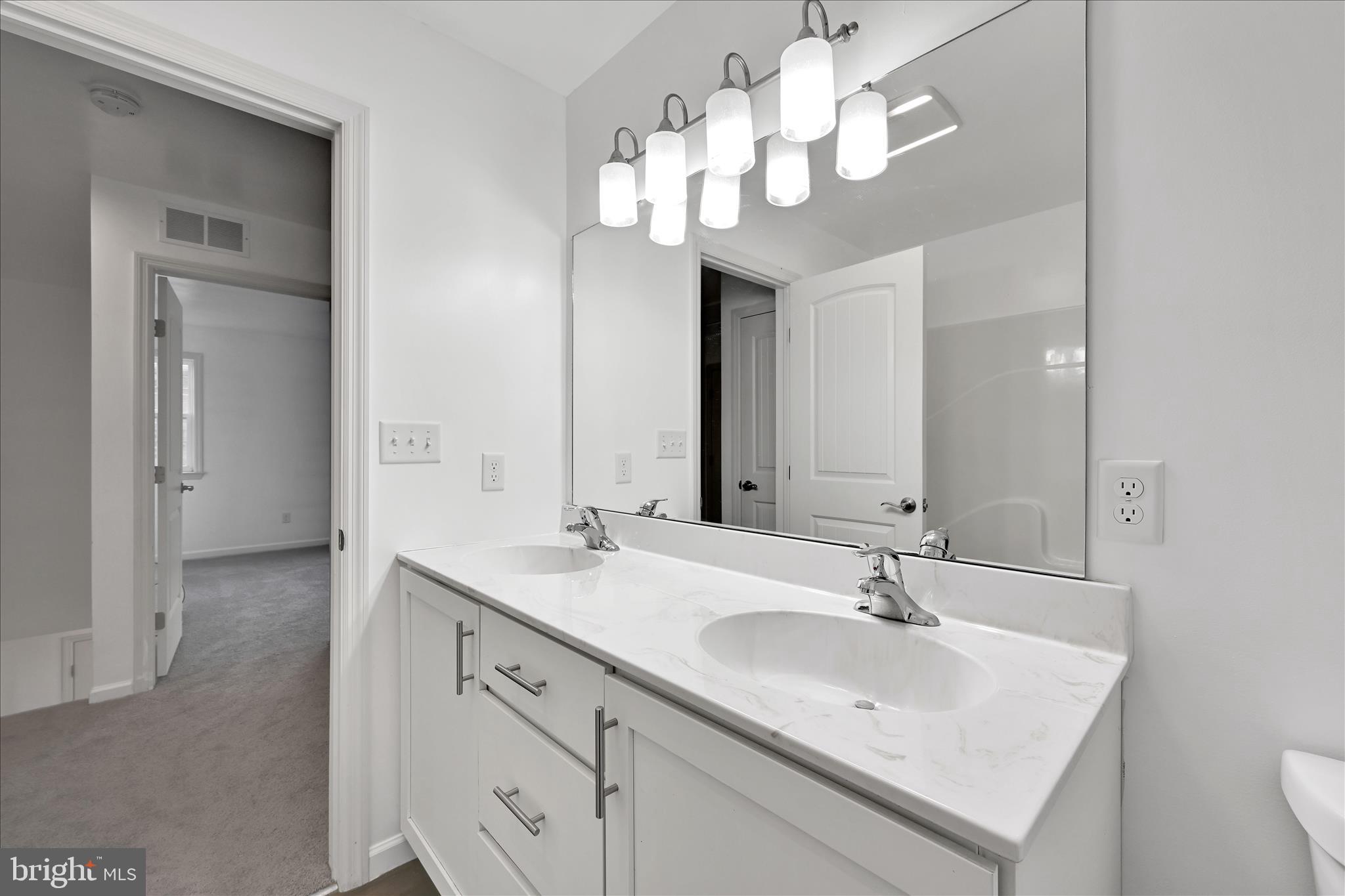 1485 Graystone Road Manheim, PA 17545 - Photo 24 of 43 a bathroom with a sink a light fixture and a mirror