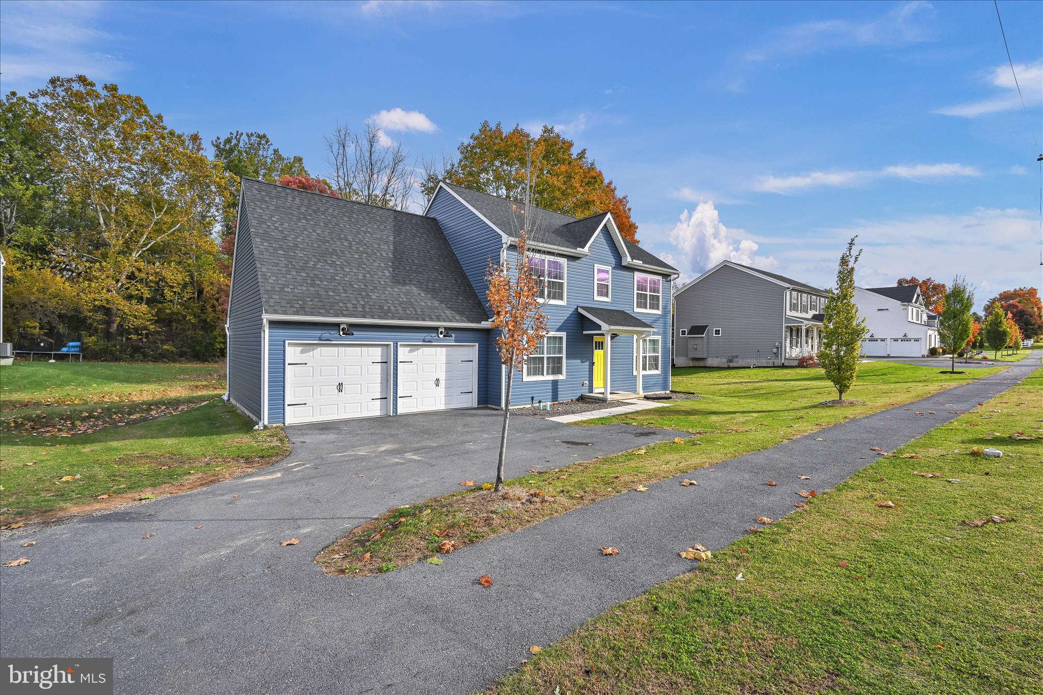 1485 Graystone Road Manheim, PA 17545 - Photo 5 of 43 a front view of a house with a yard and garage