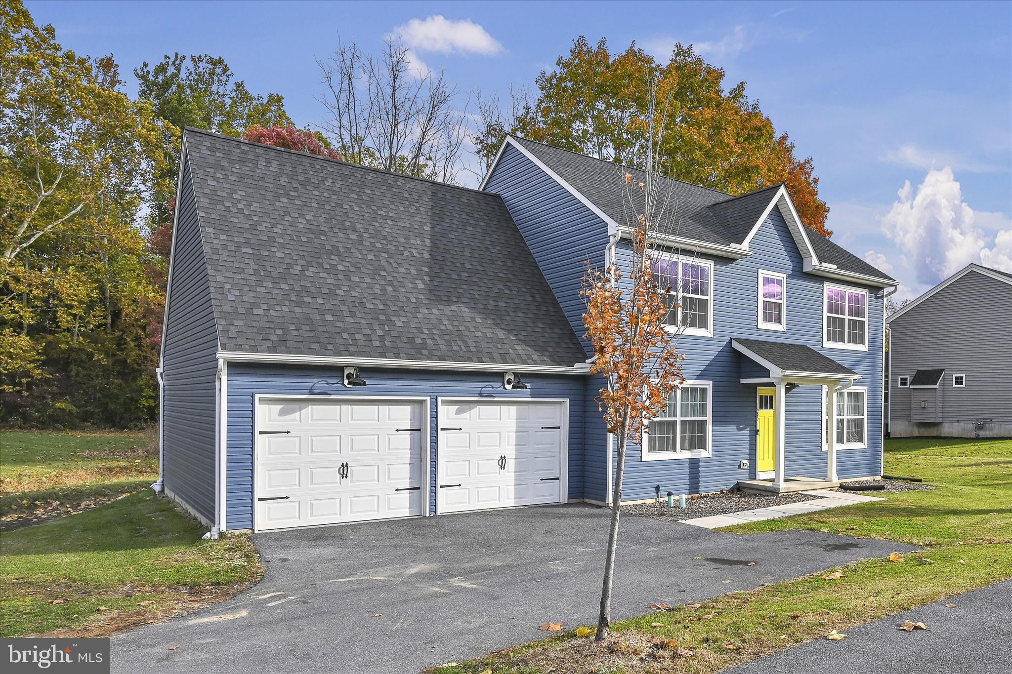 1485 Graystone Road Manheim, PA 17545 - Photo 6 of 43 a front view of a house with a garden and yard