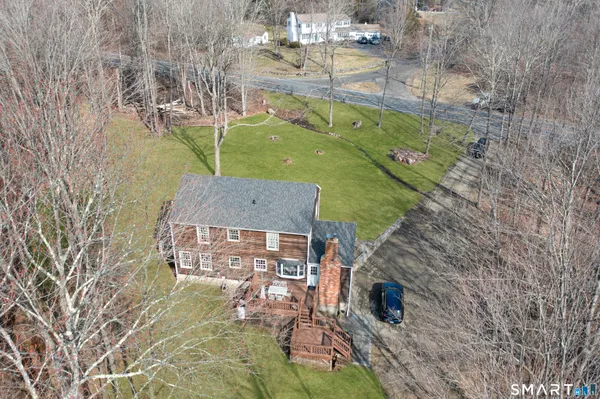 a aerial view of a house with a yard