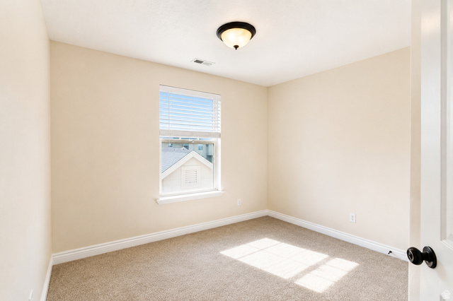 896 Cres Drive South Mapleton, UT 84664 - Photo 20 of 32 Neutral-toned room featuring a single window with blinds, carpeted flooring, and a flush mount ceiling light fixture