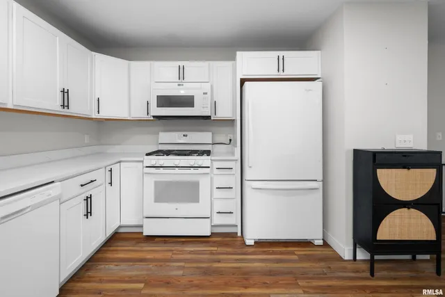 a white refrigerator freezer sitting in a kitchen