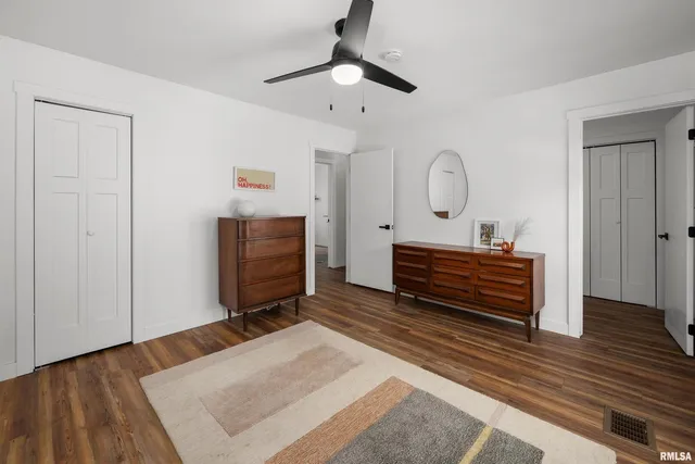 a bedroom with a bed and a dresser