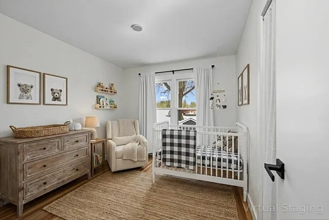a bedroom with furniture and window