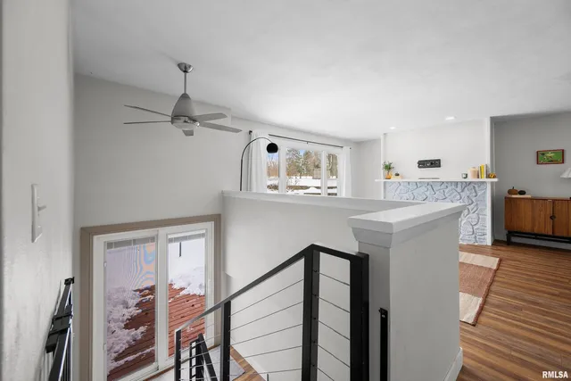 a kitchen with kitchen island a counter top space a sink stainless steel appliances and cabinets