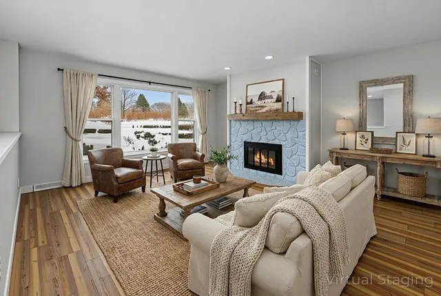 a living room with furniture and a fireplace