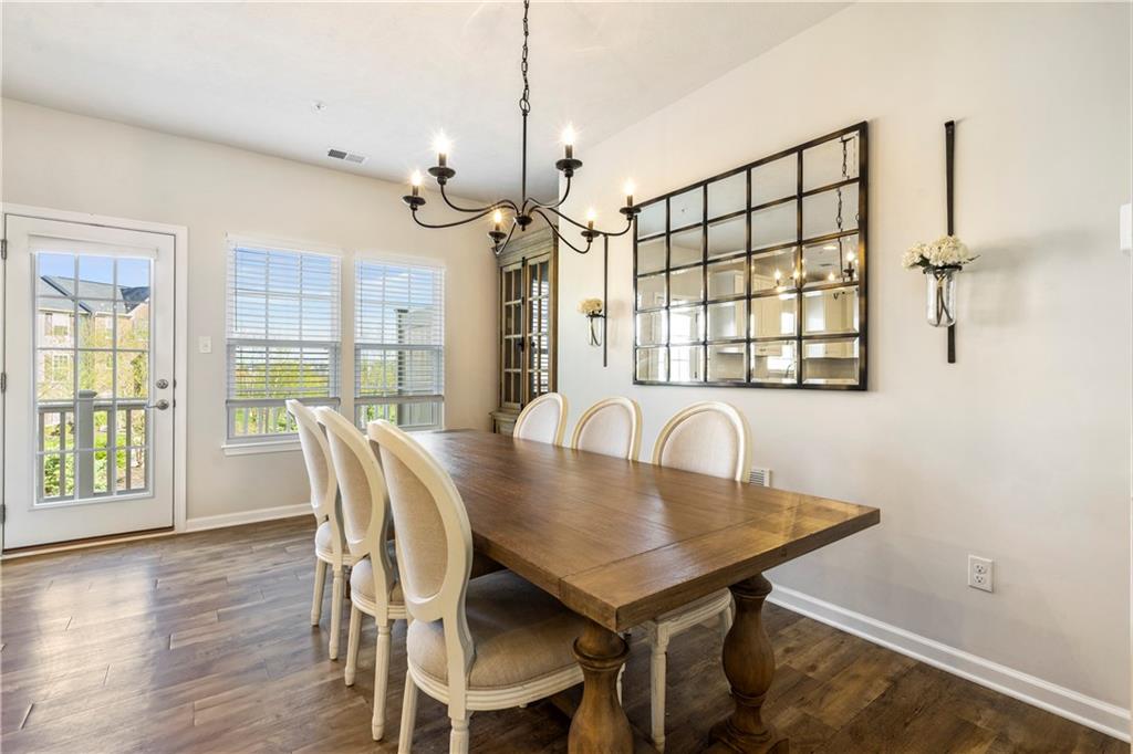 104 Pointe View Drive Mars, PA 16046 - Photo 12 of 25 a view of a dining room with furniture a chandelier and wooden floor