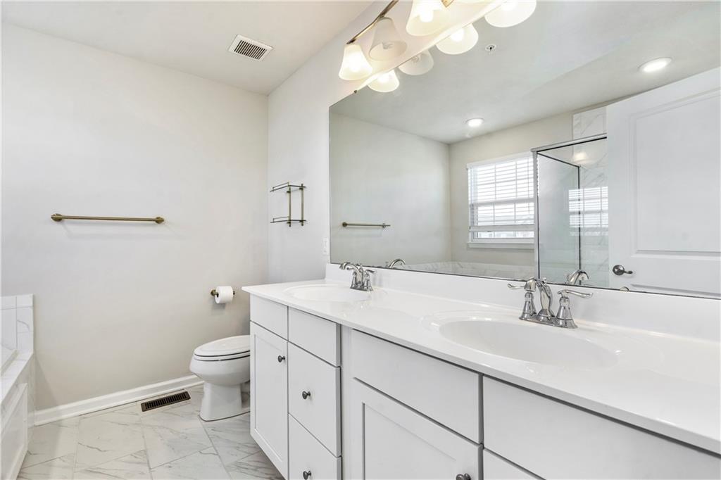 104 Pointe View Drive Mars, PA 16046 - Photo 15 of 25 a bathroom with a double vanity sink mirror and toilet