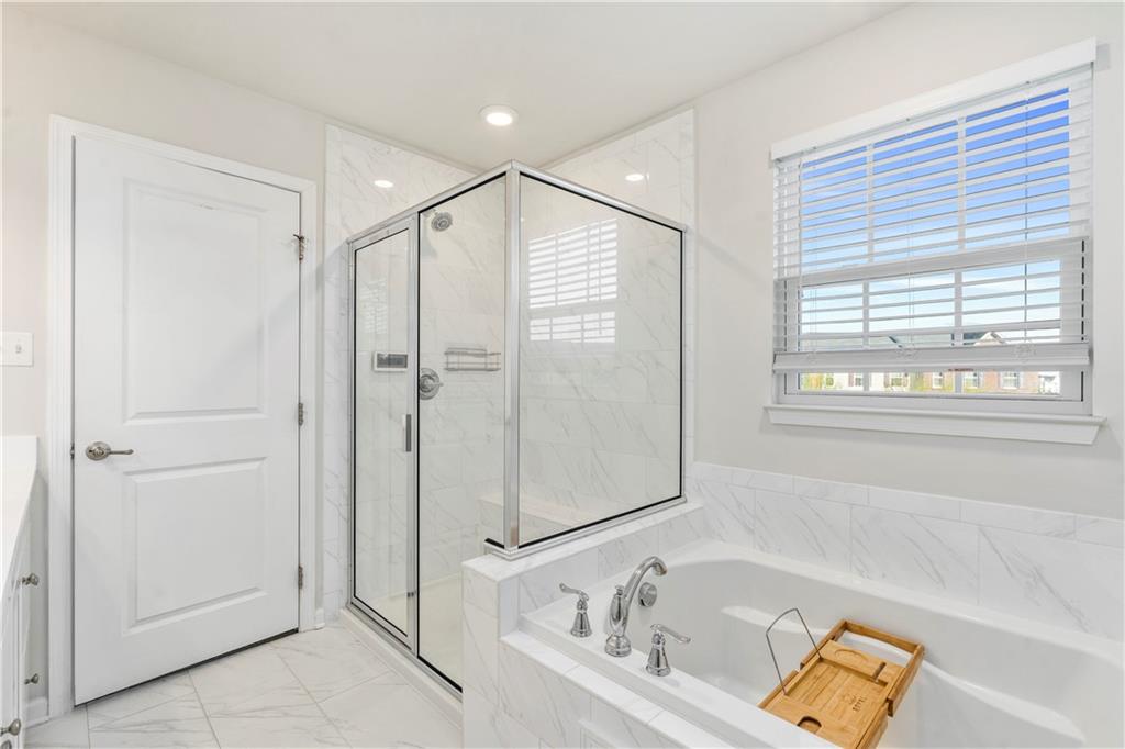 104 Pointe View Drive Mars, PA 16046 - Photo 16 of 25 a bathroom with a tub and a sink