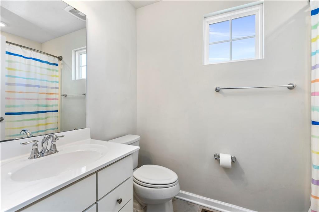 104 Pointe View Drive Mars, PA 16046 - Photo 20 of 25 a bathroom with a sink toilet and vanity